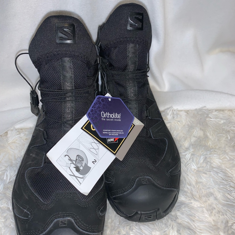 Salomon brand new Hiking boots women’s 12.5 or men’s 11.5